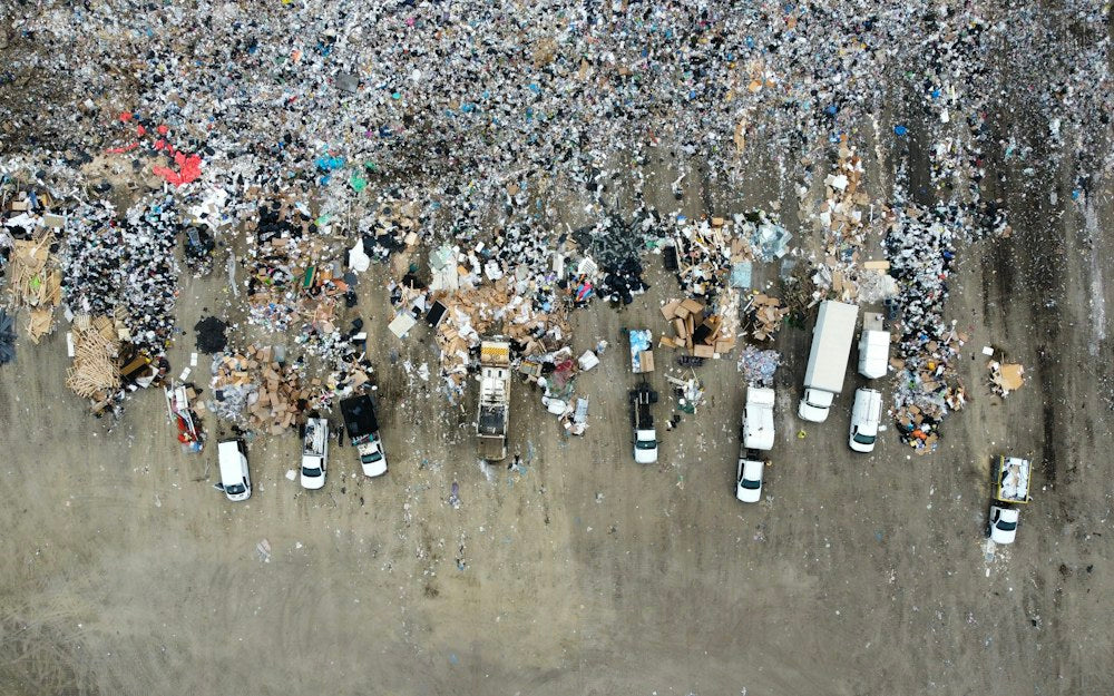 Aerial view of a landfill and waste-handling vehicles